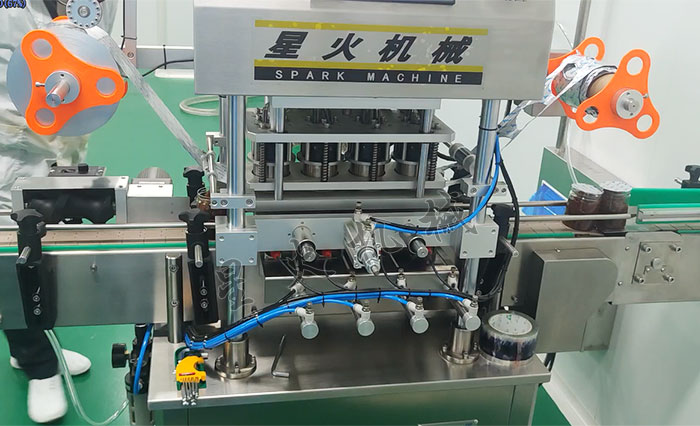 塑料瓶自動(dòng)封膜機(jī)設(shè)備